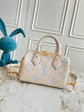 Light-colored embossed leather mini handbag