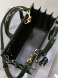 Green patent leather handbag from the Saint Laurent Sac De Jour collection